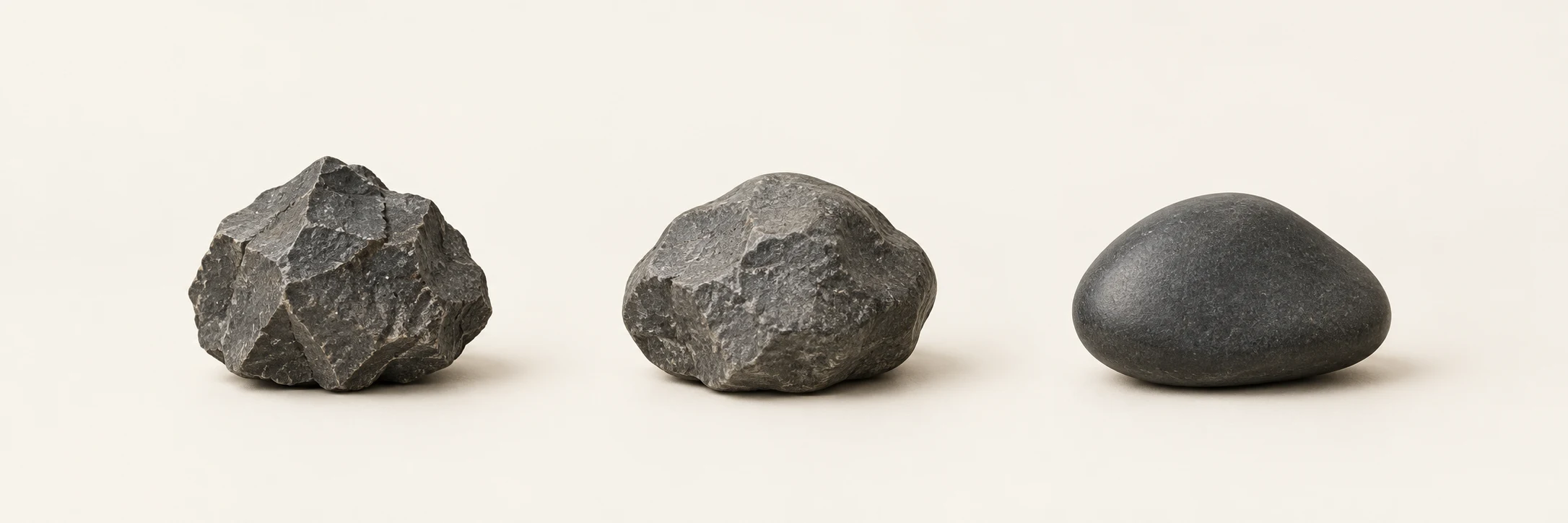 Three dark stones suggest a progression from angular and rough to rounded and smooth — a metaphor for refining software.